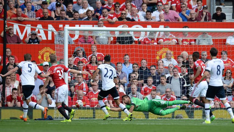 Manchester United's Sergio Romero dives to make a save