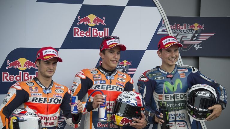 (L-R) Dani Pedrosa, Marc Marquez and Jorge Lorenzo celebrate at the end of the qualifying practice in Indianapolis. 