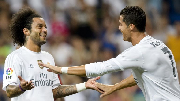 Real Madrid's Brazilian defender Marcelo (L) celebrates a goal with teammate Real Madrid's Portuguese forward Cristiano Ronaldo (R) 