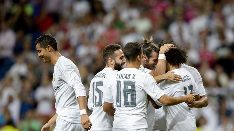 Real Madrid's Brazilian defender Marcelo is congratulated by his team-mates after scoring the winner against Galatasaray