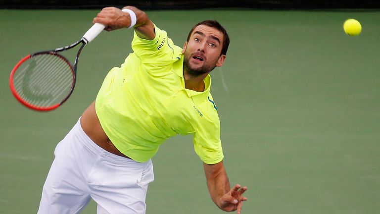 Marin Cilic of Croatia serves to Sam Querrey of the United States during their men's singles match at Rock Creek Tennis Center on August 6, 2015 