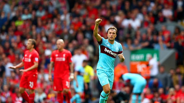 Mark Noble of West Ham United celebrates scoring his team's second goal from the penalty spot during the Barclays Premier League match at Liverpool