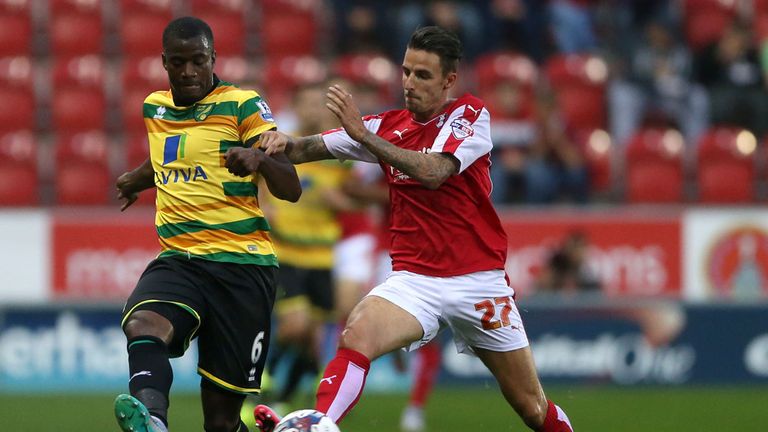 Rotherham United's Matt Derbyshire (right) and Norwich City's Sebastien Bassong battle for the ball 