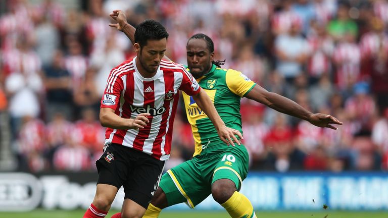 Maya Yoshida is closed down by Cameron Jerome