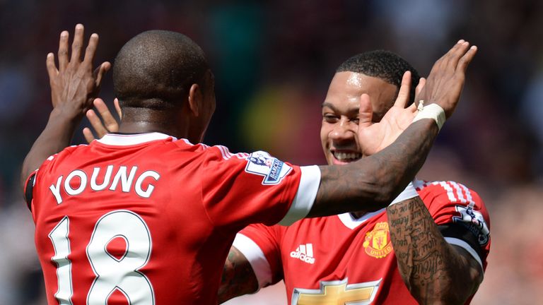 Memphis Depay celebrates with Ashley Young
