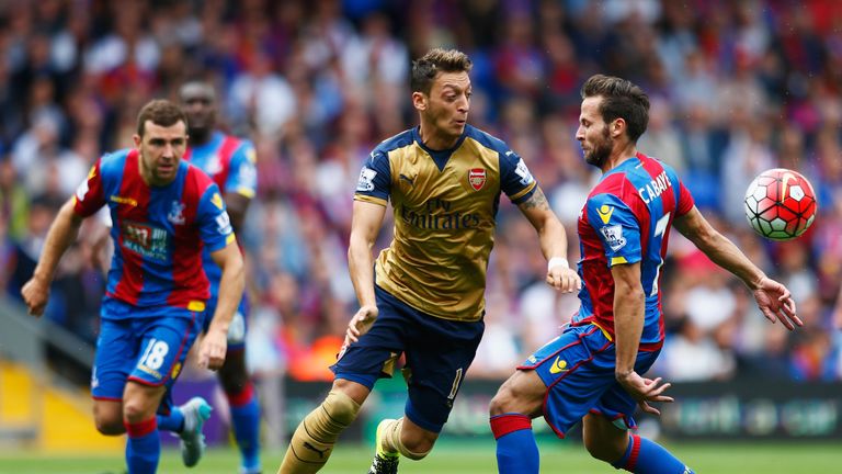 Mesut Ozil of Arsenal is challenged by Yohan Cabaye of Crystal Palace during the Barclays Premier League match at Selhurst Park