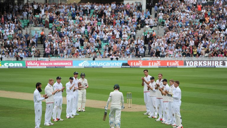 England players form a guard of honour as Australian captain Michael Clarke walks out to bat in his final test during day one