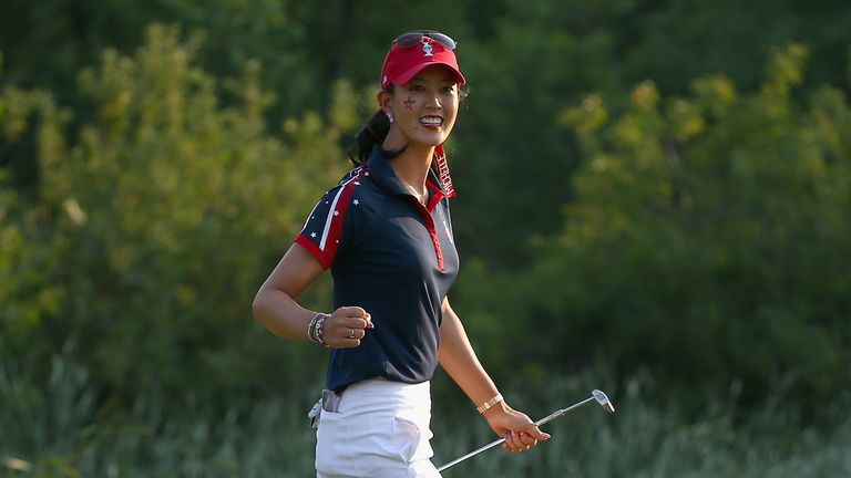 PARKER, CO - AUGUST 16:  Michelle Wie of the USA Solheim Cup Team celebrates after making the winning putt on the 17th green in her 2&1 victory during the 