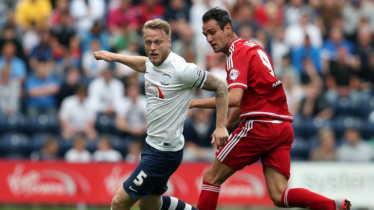 Tom Clarke of Preston in action with Kike of Middlesbrough