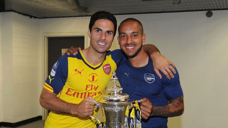 Mikel Arteta and Theo Walcott with the FA Cup Trophy after the match between Arsenal and Aston Villa in the FA Cup Final at Wembley