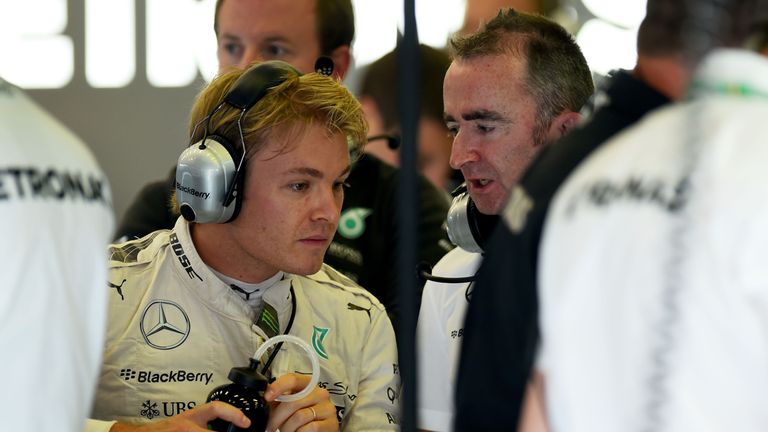 Nico Rosberg is all ears in the Mercedes garage alongside technical chief Paddy Lowe