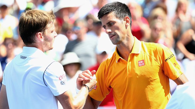 CINCINNATI, OH - AUGUST 20:  Novak Djokovic of Serbia shakes hands with David Goffin of Belarus after their match during Day 5 of the Western & Southern Op