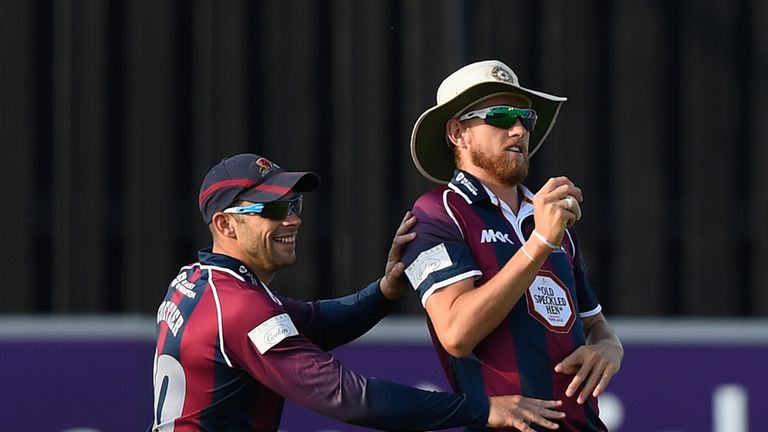 HOVE, ENGLAND - AUGUST 12:  Olly Stone of Northamptonshire celebrates with team mate Kyle Coetzer after catching Luke Wright of Sussex for a duck during th