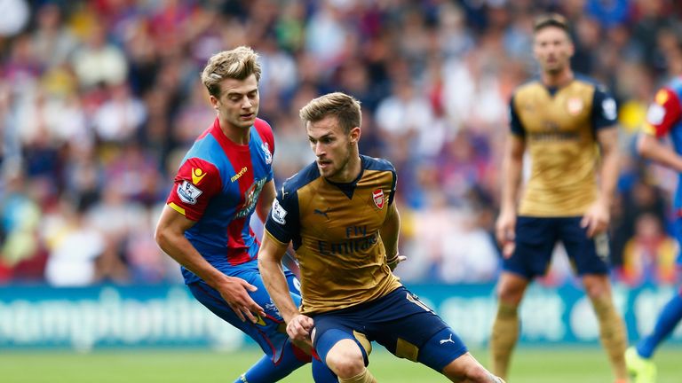 Aaron Ramsey of Arsenal is closed down by Patrick Bamford of Crystal Palace during the Barclays Premier League match at Selhurst Park