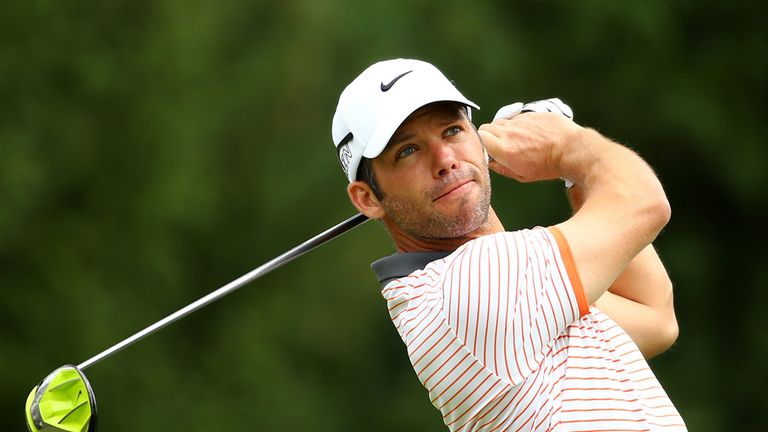 Paul Casey of England hits off the fourth tee during the first round of the World Golf Championships - Bridgestone Invitational at Firestone