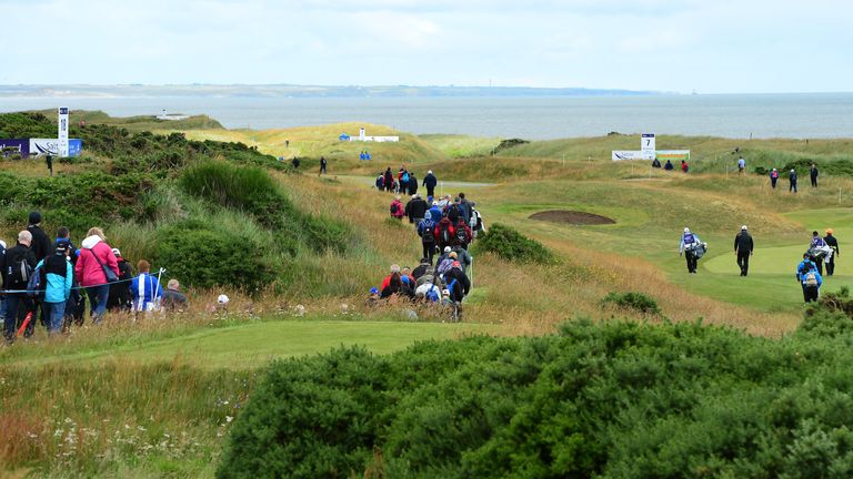 ABERDEEN, SCOTLAND - JULY 30 : Paul Lawrie of Scotland walks from the 6th tee followed by a large gallery of spectators during the first day of the Saltire