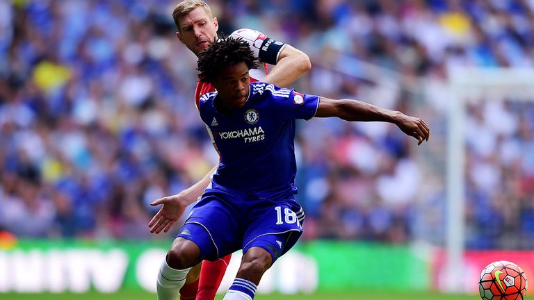 LONDON, ENGLAND - AUGUST 02:  Loic Remy of Chelsea and Per Mertesacker of Arsenal compete for the ball during the FA Community Shield match between Chelsea