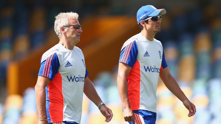 Head Coach Peter Moores (left) walks with captain Alastair Cook during England's tour of the West Indies in April, 2015.
