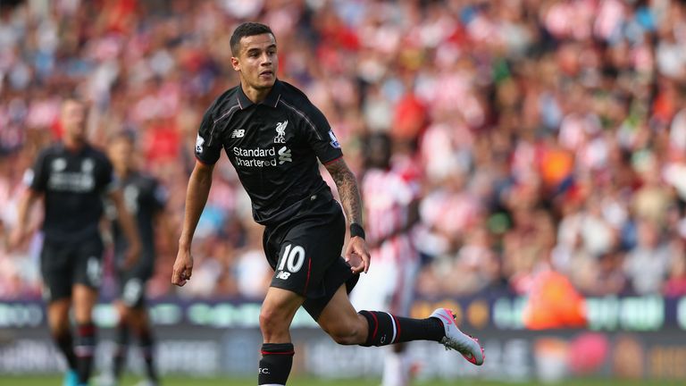 STOKE ON TRENT, ENGLAND - AUGUST 09:  Philippe Coutinho of Liverpool looks on as he scores their first goal during the Barclays Premier League match betwee