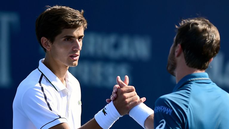 WINSTON-SALEM, NC - AUGUST 28:  Pierre-Hugues Herbert (left) of France and Steve Johnson shake hands after their match during the fifth day of the Winston-
