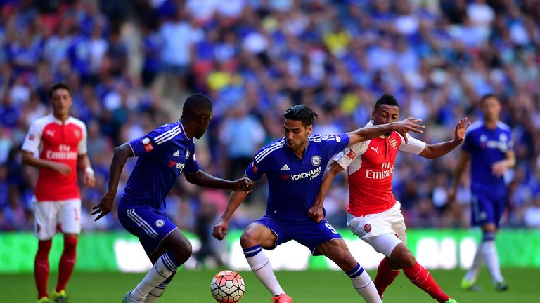 LONDON, ENGLAND - AUGUST 02:  Radamel Falcao Garcia of Chelsea and Francis Coquelin of Arsenal compete for the ball during the FA Community Shield match be