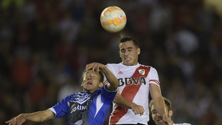 River Plate defender Ramiro Funes Mori vies for the ball with San Jose's defender Arnaldo Vera during a 2015 Copa Libertadores game in Buenos Aires.