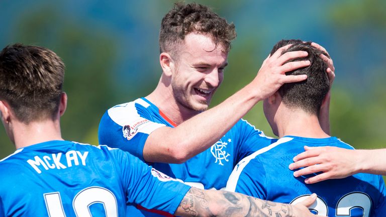 Rangers' Andy Halliday celebrates with Jason Holt after he makes it 3-1.