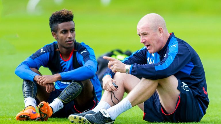 Rangers manager Mark Warburton (right) has signed three players on loan from England including Arsenal's Gedion Zelalem (left)