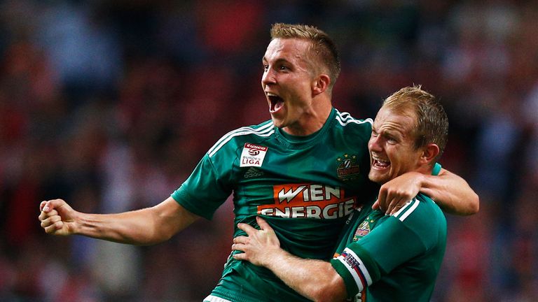 AMSTERDAM, NETHERLANDS - AUGUST 04:  Christopher Dibon (L) and Mario Sonnleitner (R) of Rapid Wien celebrate after victory in the third qualifying round 2n