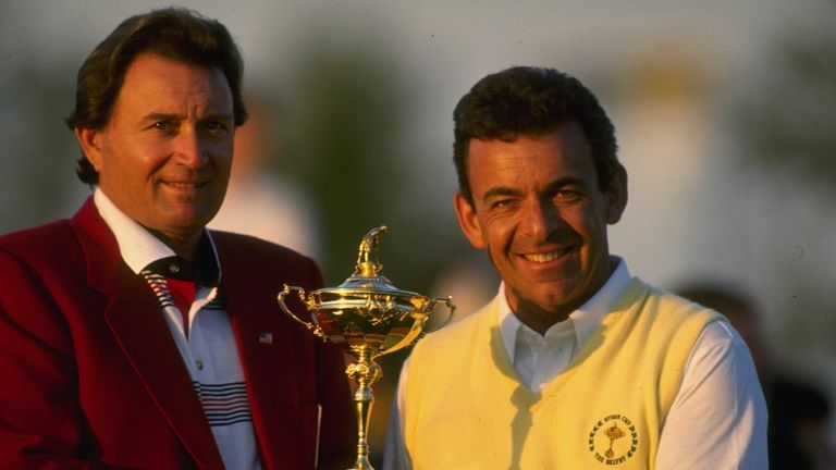 1985:  USA team Captain Ray Floyd (left) and European team Captain Tony Jacklin (right) of England pose with the trophy during the Ryder Cup at The Belfry 