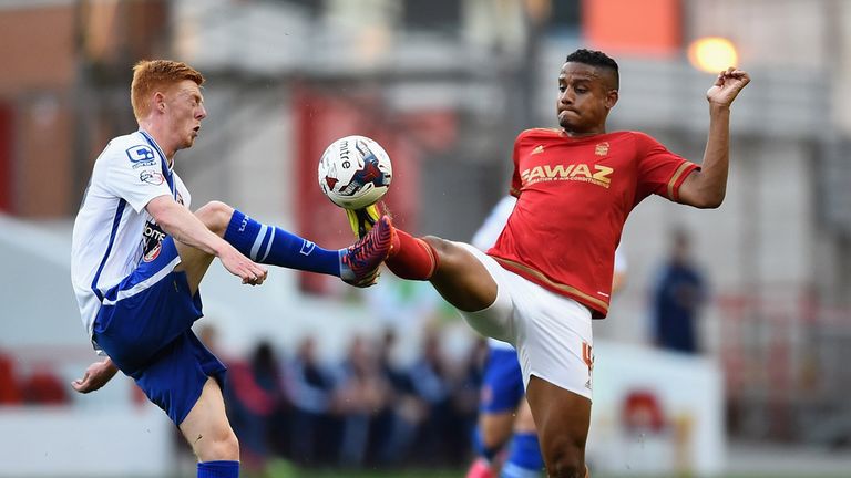 NOTTINGHAM, ENGLAND - AUGUST 11: Michael Mancienne of Nottingam Forest battles with Reece Flanagan of Walsall during the Capital One Cup First Round match 