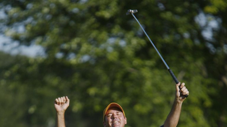 Rich Beem celebrates sinking his final putt on the 18th green for the victory.