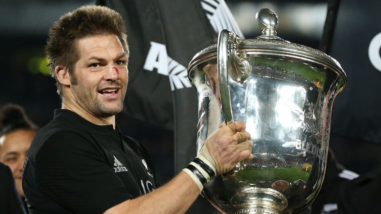 All Black captain Richie McCaw of New Zealand lifts the Bledisloe Cup following their rugby union match between the Australian Wallabies and New Zealand