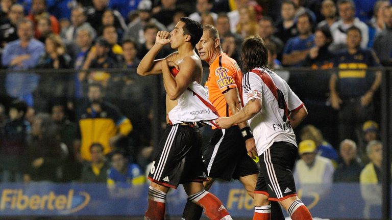 River Plate defender Ramiro Funes Mori (L) celebrates after scoring against Boca Juniors at La Bombonera in March 2014