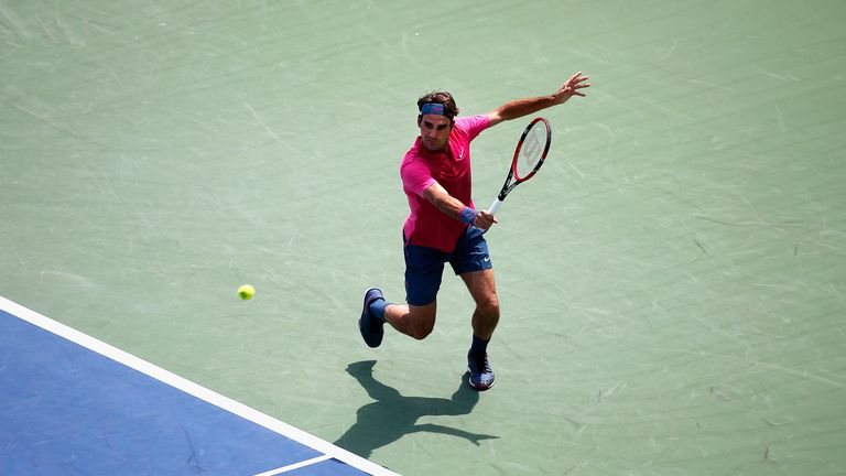 Roger Federer returns a shot to Novak Djokovic in the final of the Cincinnati Masters