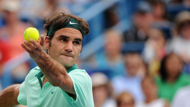  Roger Federer of Switzerland serves against David Ferrer of Spain during a final match on day 9 of the Western & Southern Open