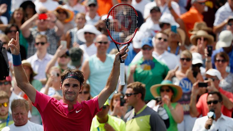 Roger Federer of Switzerland celebrates after defeating Novak Djokovic of Serbia to win the mens singles final at 