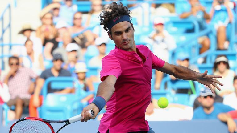 Roger Federer of Switzerland returns a shot to Andy Murray of Great Britain during the semifinals on Day 8 of the Western & So