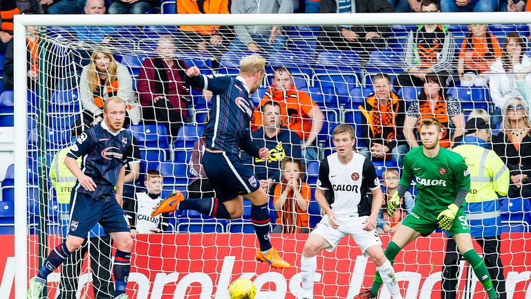 Ross County captain Andrew Davies (second left) makes it 2-0 against Dundee United