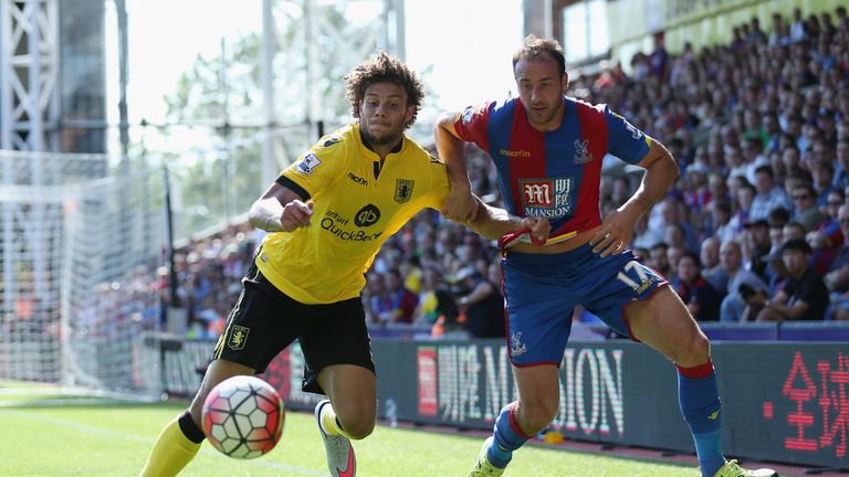 Rudy Gestede of Aston Villa and Glenn Murray of Crystal Palace compete for the ball