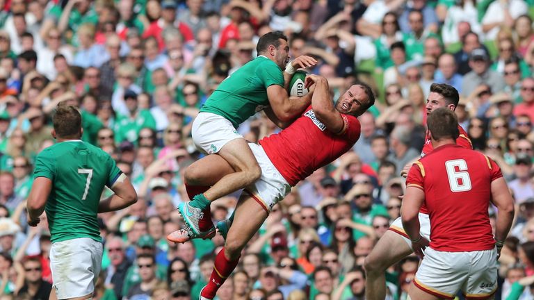 Ireland's Dave Kearney and Wales' Jamie Roberts battle for the ball