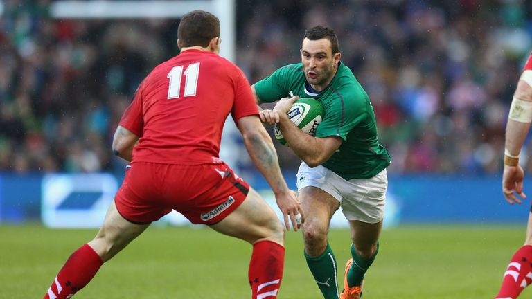 Dave Kearney (R) of Ireland runs at George North (L) of Wales during the 2014 Six Nations