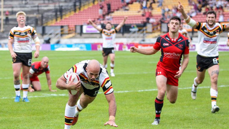 Adrian Purtell dives over to score Bradford's seventh try against Salford