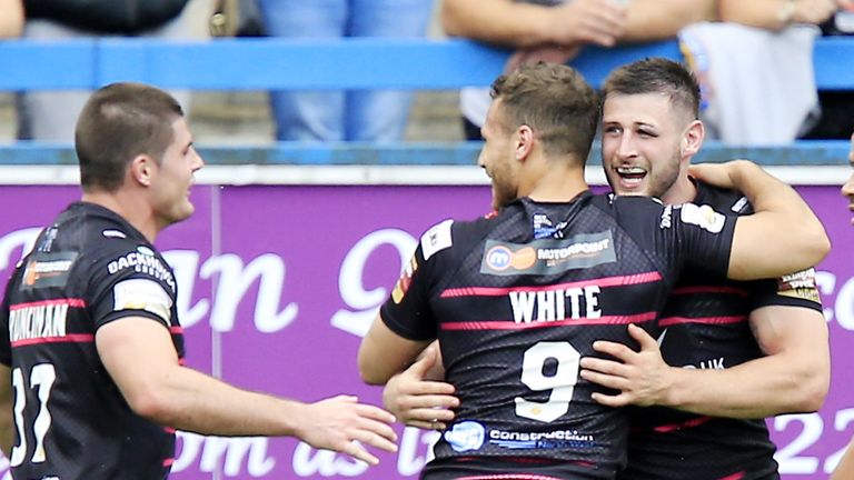 Widnes tryscorer Alex Gerrard (right) is congratulated by Charly Runciman and Lloyd White