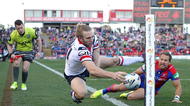 Brendon Elliot scores one of Sydney Roosters' seven tries in Newcastle