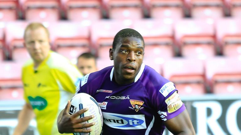 Huddersfield's Jermaine McGillvary crosses to score his second try against Wigan