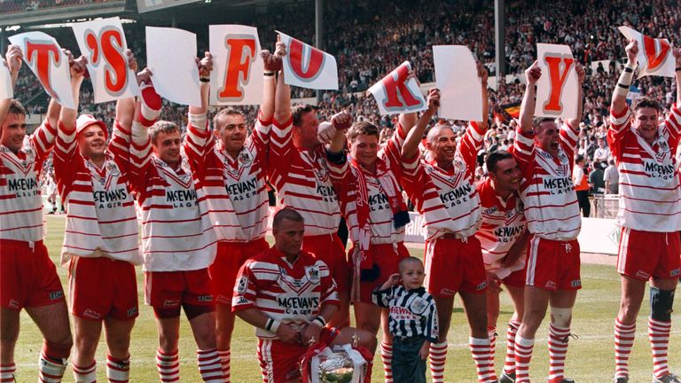 St Helens team and mascot, (team captain Bobbie Golding's son, Bobbie), celebrate their victory over Bradford Bulls in the Challenge Cup final in 1996