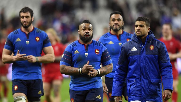 Mathieu Bastareaud (C) and France's centre Wesley Fofana (R) react after the Six Nations match between France and Wales on February 28, 2015
