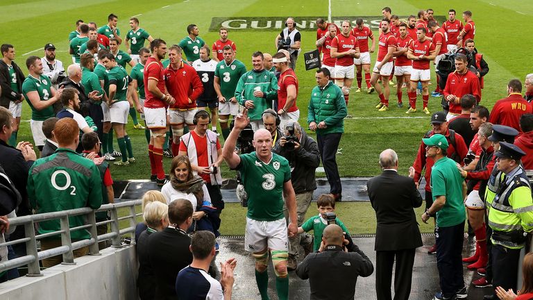 Ireland captain Paul O'Connell makes his way down the tunnel with his son Paddy, 5, after his last home international match