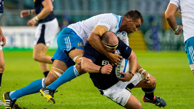 Italy captain Quintin Geldenhuys takes down Scotland's Mike Cusack